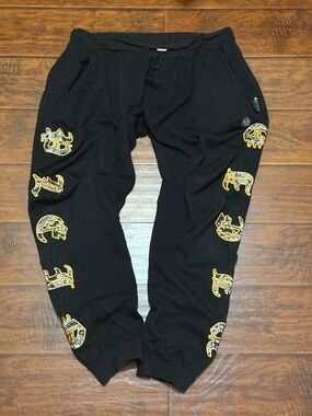 Authentic Philipp Plein Black Sweatpants with Yellow Graphic Accents